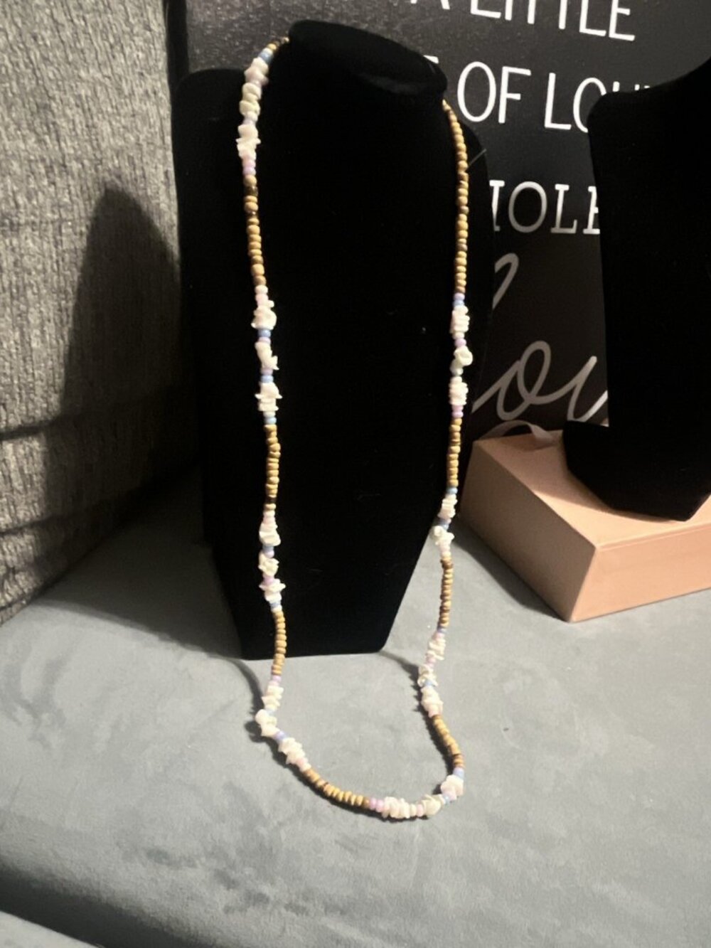 Necklace natural shell /small wooden beads In neutral, white, and pastel tones.
